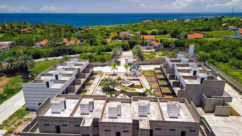 Aerial view of Los Geckos with ocean